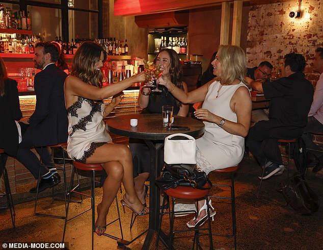 As they entered the restaurant and sat to enjoy a few pre-dinner aperitifs, the trio were seen laughing and joking as they quaffed their cocktails