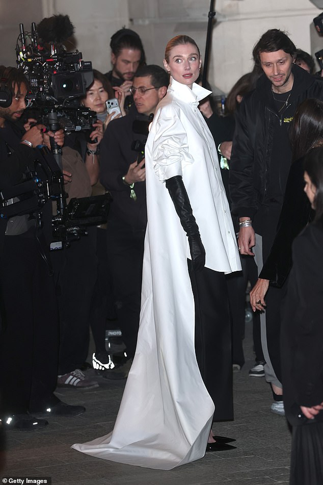 Elizabeth Debicki oozed class in a white shirt with a dramatic long train, paired with black trousers