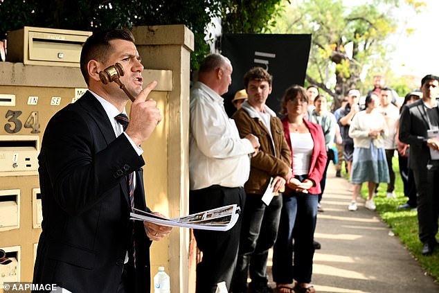 Economists warn those who bought with the five per cent deposit scheme are at risk of rate hikes (stock image)