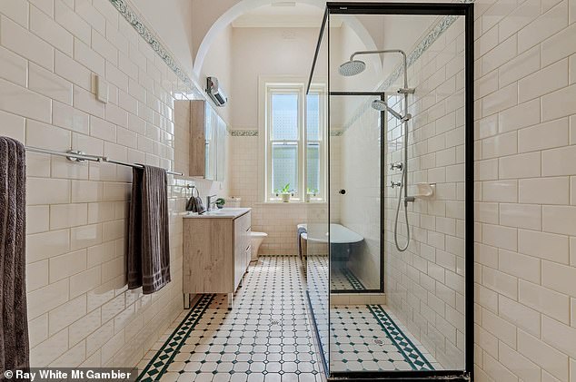 Old World style is prominently featured in the main bathroom, such as tessellated floor tiles and a claw-foot tub