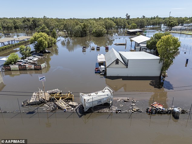 Like many laid-back locals, Luke Pote doesn't usually stay up to date with weather advice at his remote community (pictured, flooding in Chinchilla on March 13)