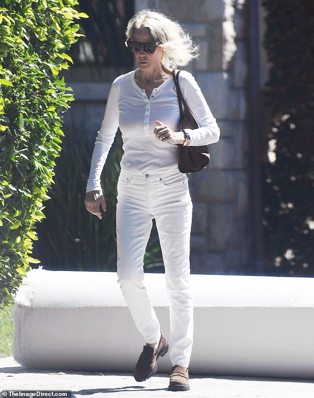 The star was spotted this week in a white shirt and slacks with brown loafers, adding black sunglasses while in Los Angeles. Can you guess who she is?