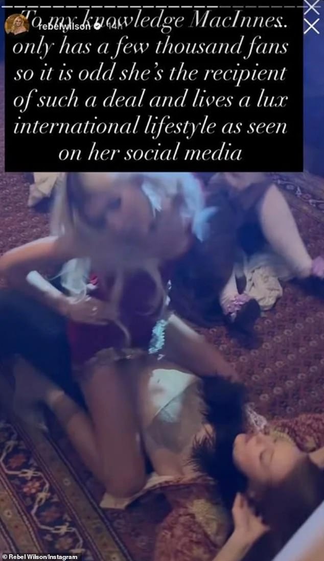 Pictured: An image posted by Wilson on Wednesday with two women in a sexual position on the floor. Wilson wrongly implied one of the women was MacInnes