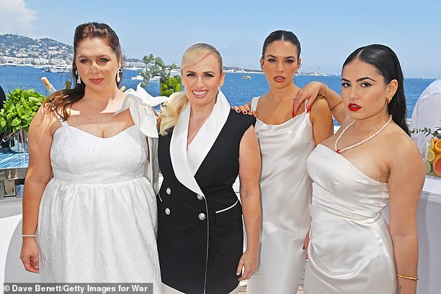 Pictured: Rebel Wilson and Charlotte MacInnes (together, centre) at a party hosted by Wilson