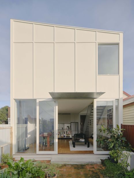 Vertical battens on the eastern facade riff on the rhythm of the weatherboards.