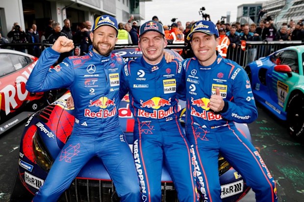 Max Verstappen poses with his teammates.