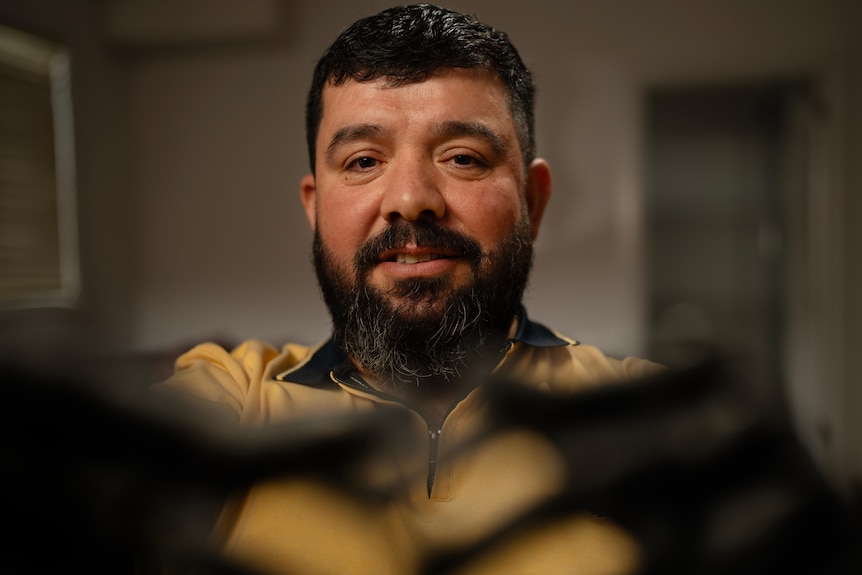 A man looks at the camera.