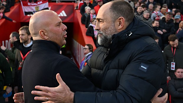 Arne Slot interacts with Igor Tudor.