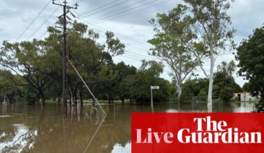 Australia news live: Queensland on flood alert as NT communities warned deluge could last a week; ASX plunges as oil prices surge | Australia news
