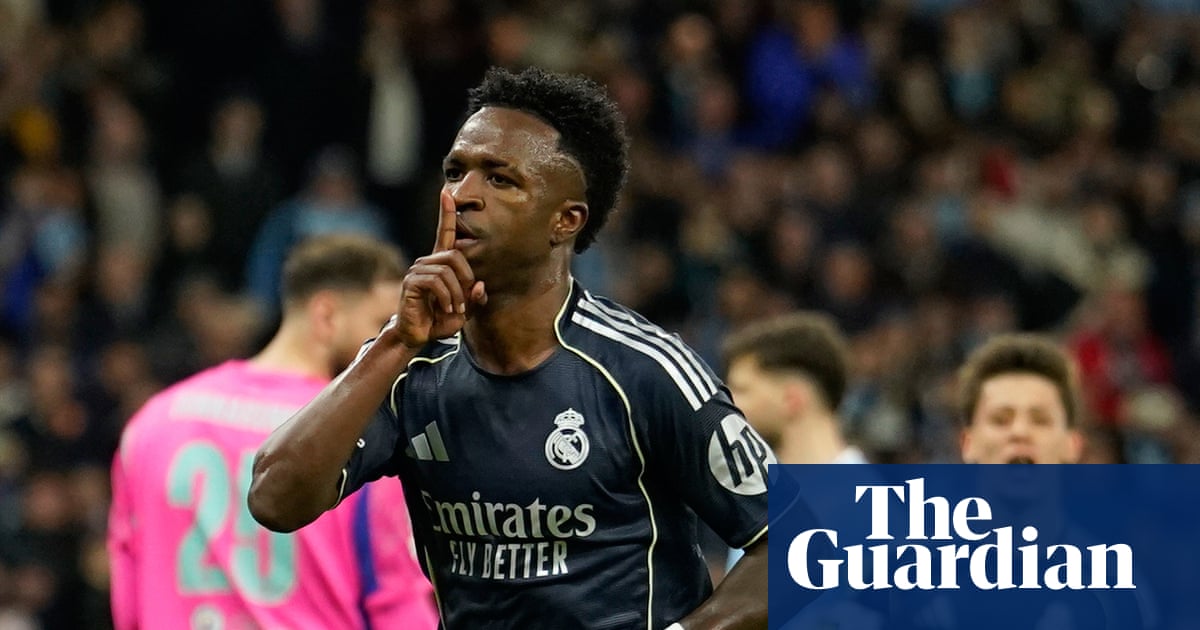 Vinícius finishes off 10-man Manchester City as Real Madrid ease into last eight | Champions League