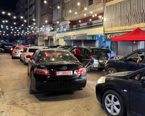 People leave in their cars after Israeli strikes on Beirut’s southern suburbs on Monday