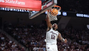 Marcus Hill driving the lane against Texas