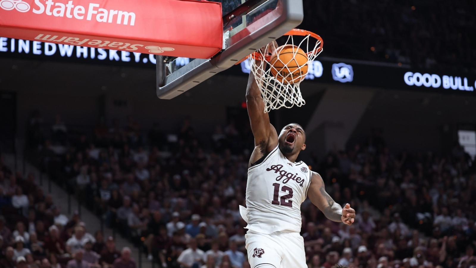 Marcus Hill driving the lane against Texas