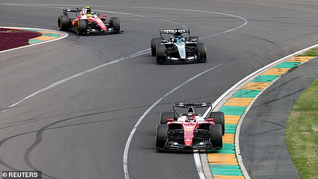 Formula One F1 - Australian Grand Prix - Albert Park Grand Prix Circuit, Melbourne, Australia - March 8, 2026 Ferrari's Charles Leclerc in action ahead of Mercedes' George Russell during the race REUTERS/Mark Peterson
