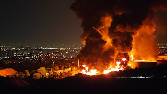 Fire and smoke rise into the sky after an Israeli attack on the Shahran oil depot in Tehran on Sunday. Oil prices across the globe are expected to climb even further if the war drags on.
