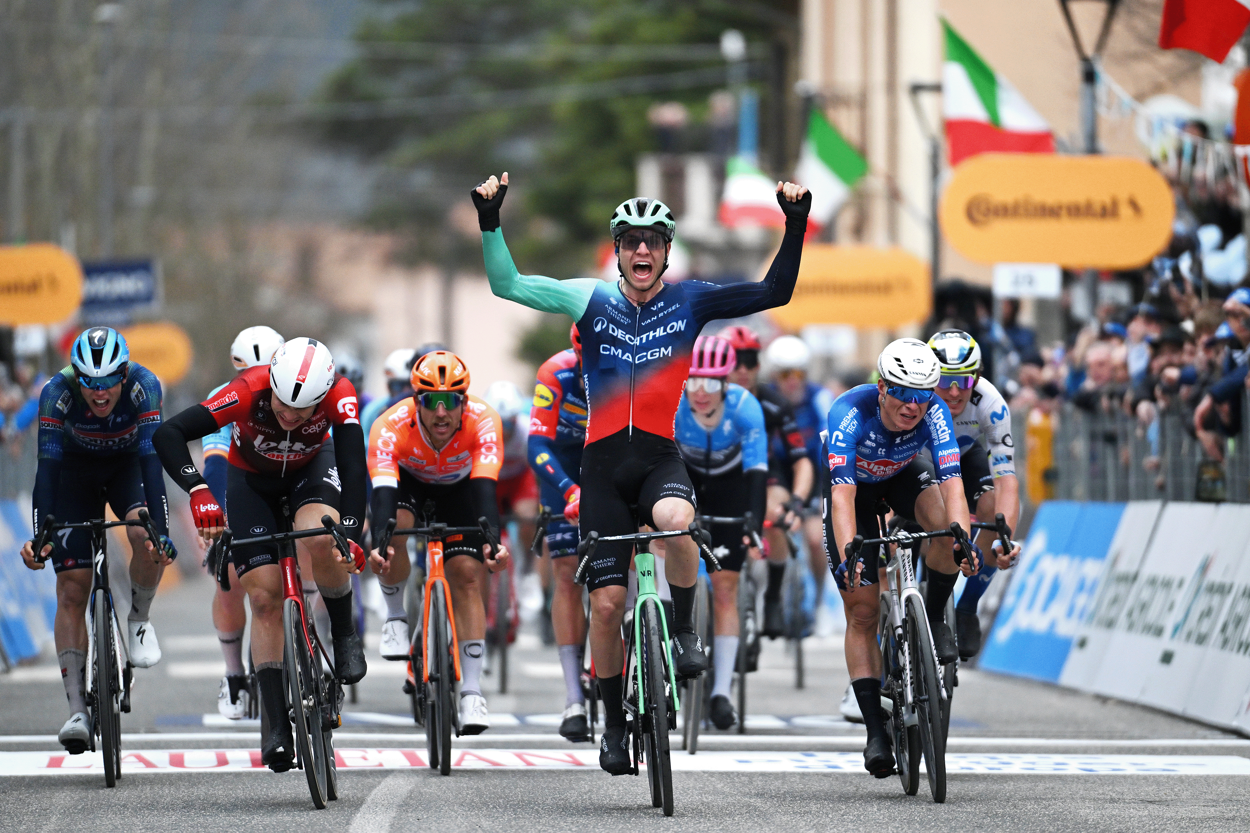 MAGLIANO DE' MARSI, ITALY - MARCH 11: Tobias Lund Andresen of Denmark and Team Decathlon CMA CGM (C) celebrates at finish line as stage winner ahead of Arnaud De Lie of Belgium and Team Lotto Intermarch&eacute; and Jasper Philipsen of Belgium and Team Alpecin-Premier Tech during the 61st Tirreno-Adriatico 2026, Stage 3 a 221km stage from Cortona to Magliano de' Marsi 332m / #UCIWT / on March 11, 2026 in Magliano de' Marsi, Italy. (Photo by Tim de Waele/Getty Images)