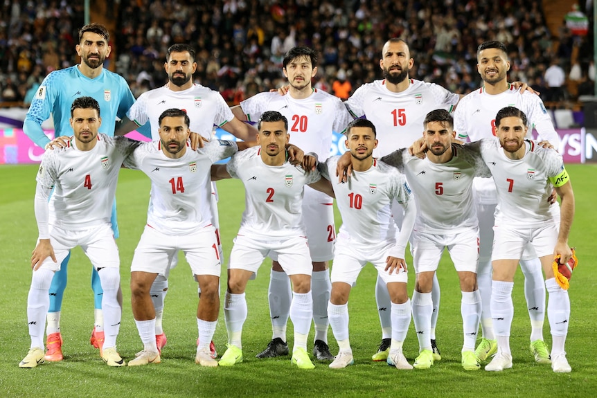Iran men's team pose for a pre-match photograph