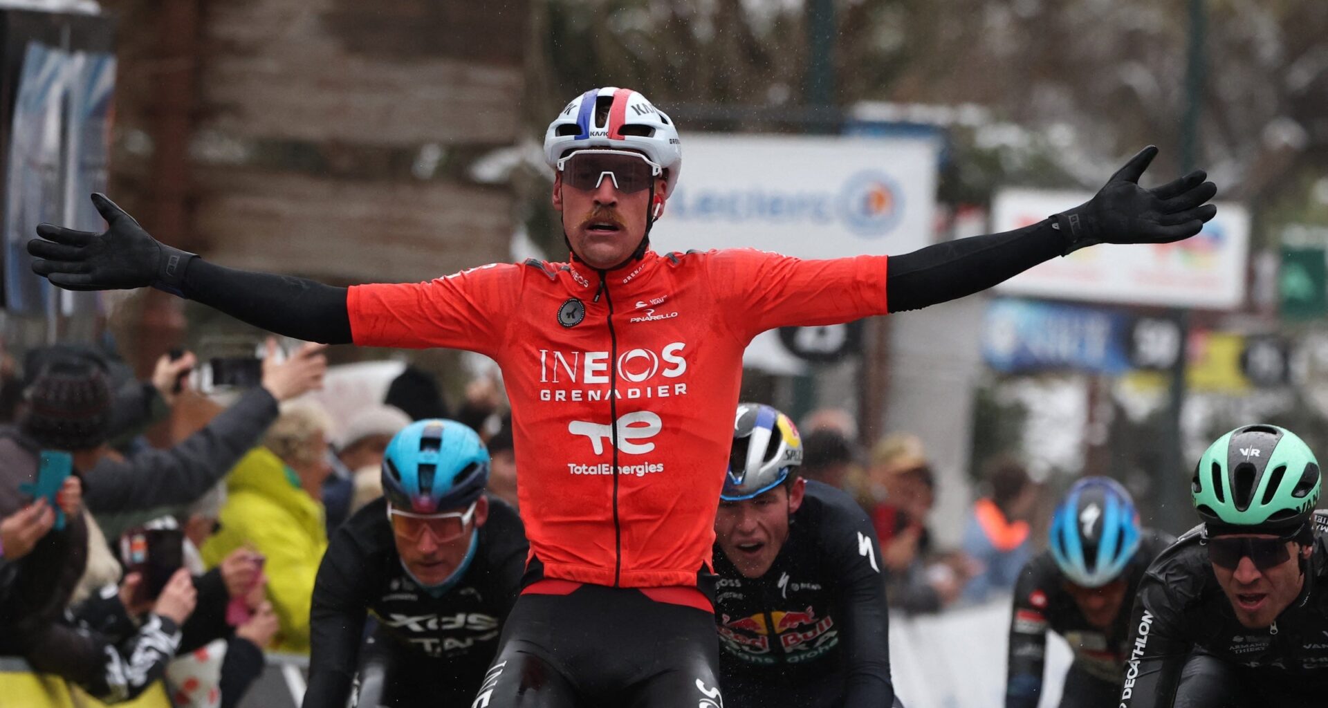 Dorian Godon celebrates his win on the seventh stage of Paris-Nice cycling race (Photo by Anne-Christine Poujoulat / AFP)