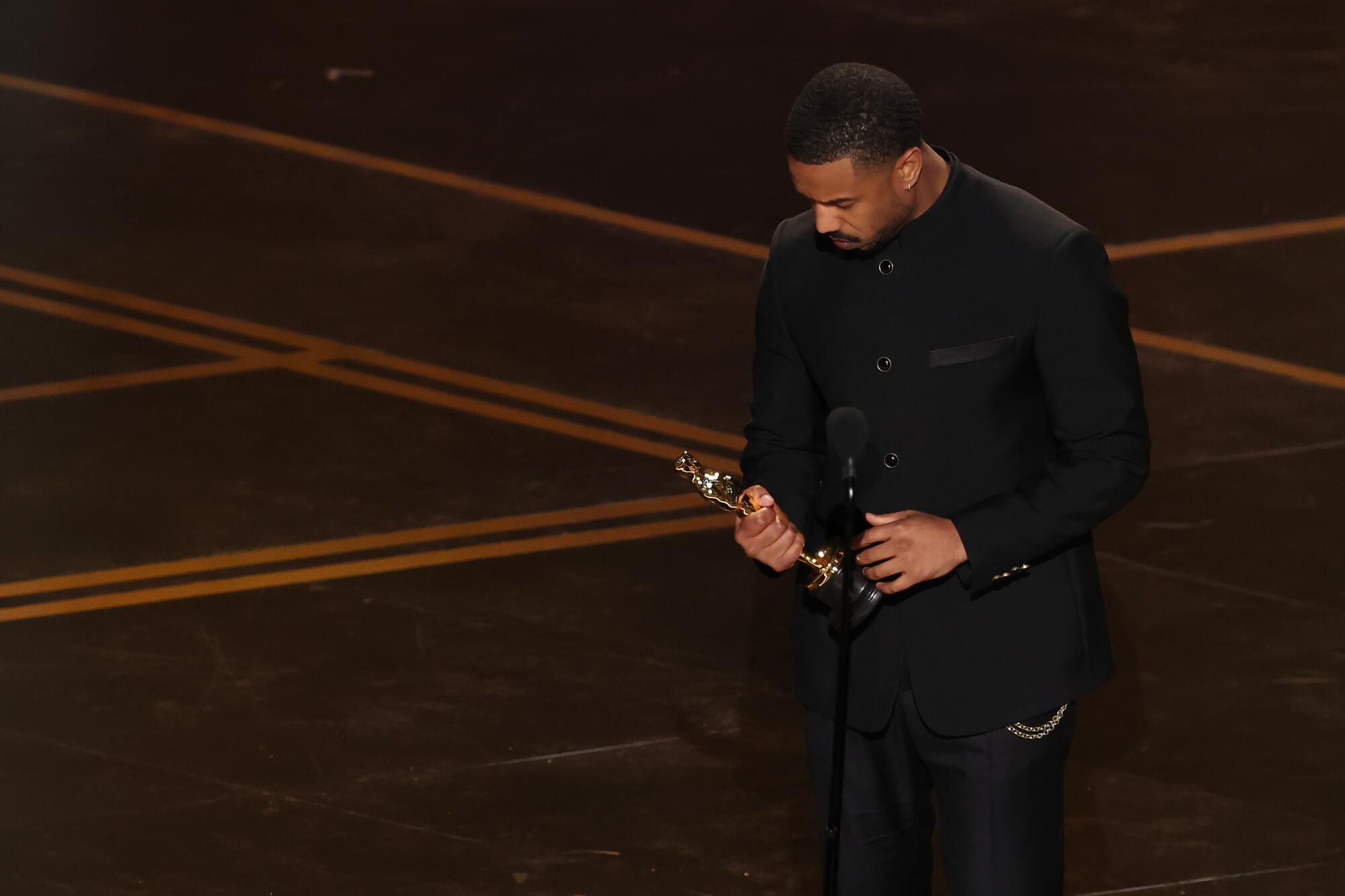 Michael B. Jordan accepts the Oscar for lead actor for "Sinners."