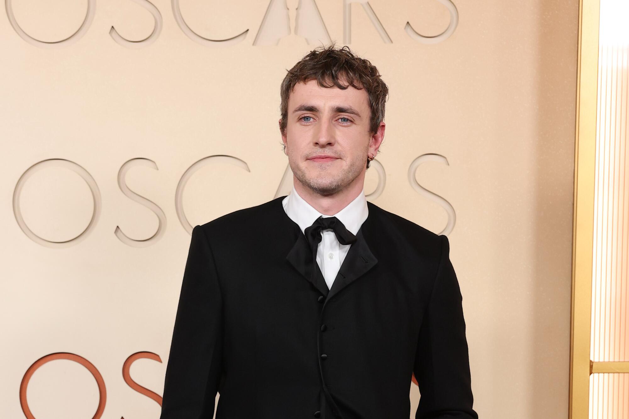 Paul Mescal arrives on the red carpet in a black jacket and tie