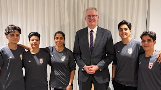 Minister for Home Affairs Tony Burke with five Iranian women soccer players who were granted asylum on Monday night. Some of the players have now left Australia.