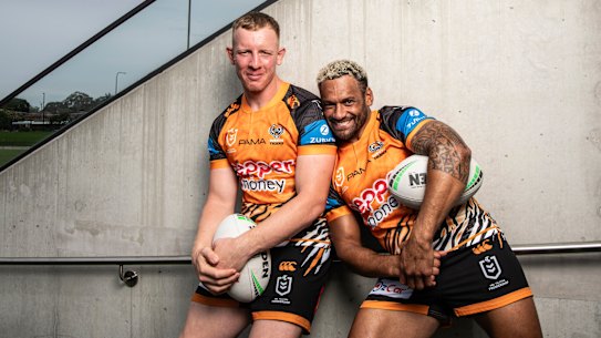 Tigers players Api Koroiusa and Alex Seyfarth celebrate the NRL’s Multicultural round.