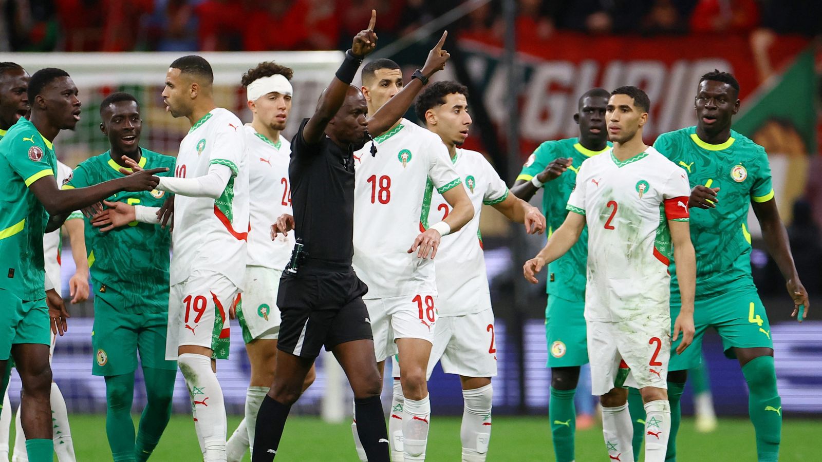 Referee Jean-Jacques Ndala awards a penalty to Morocco after a VAR review. Pic: Reuters
