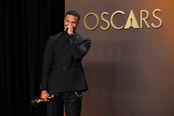 Michael B. Jordan, winner of the award for actor in a leading role for "Sinners," poses in the press room at the Oscars on Sunday, March 15, 2026, at the Dolby Theatre in Los Angeles. (Photo by Jordan Strauss/Invision/AP)