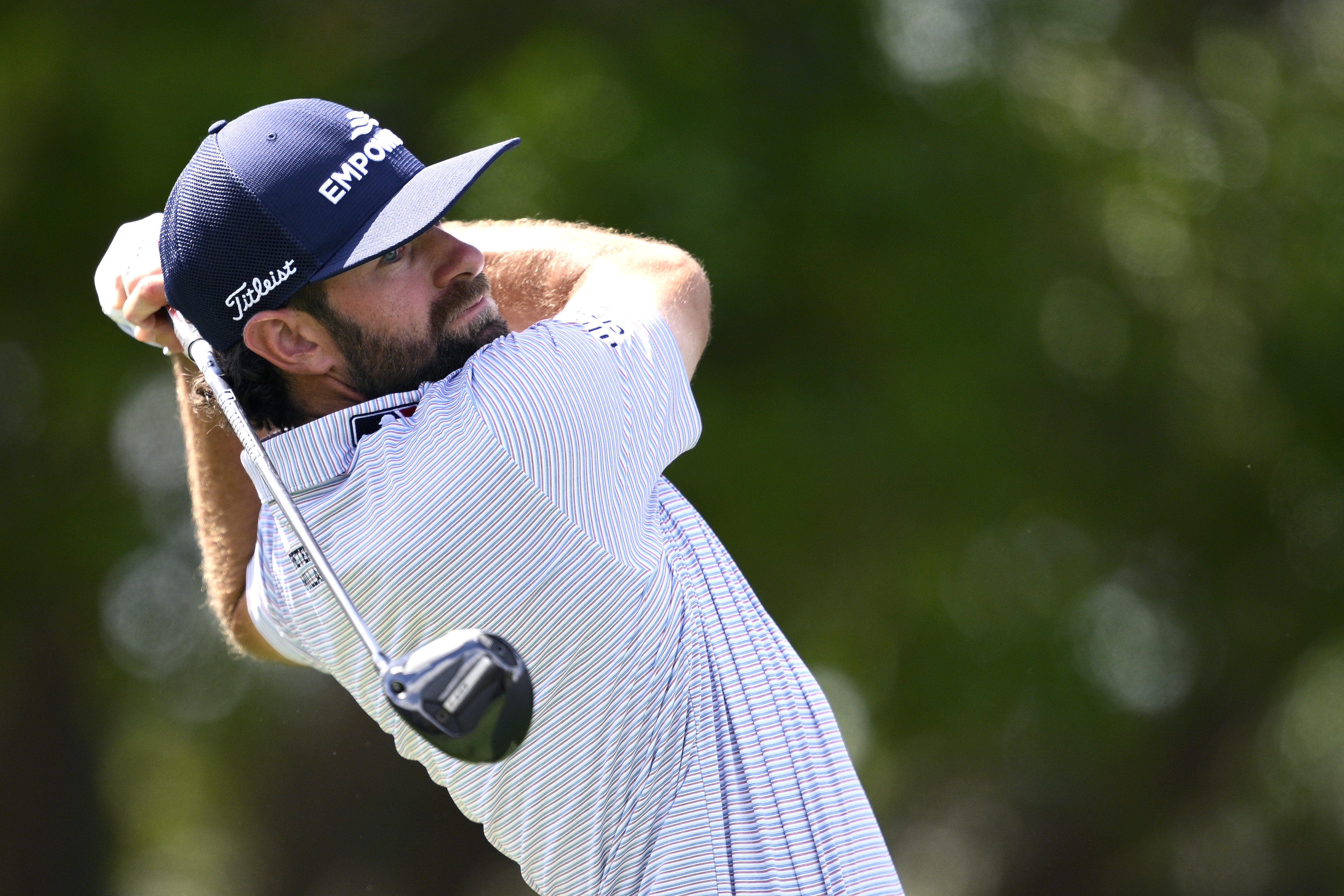 Cameron Young hits a fairway wood off the tee