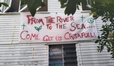 Police raid house showing ‘from the river to the sea’ banner outside