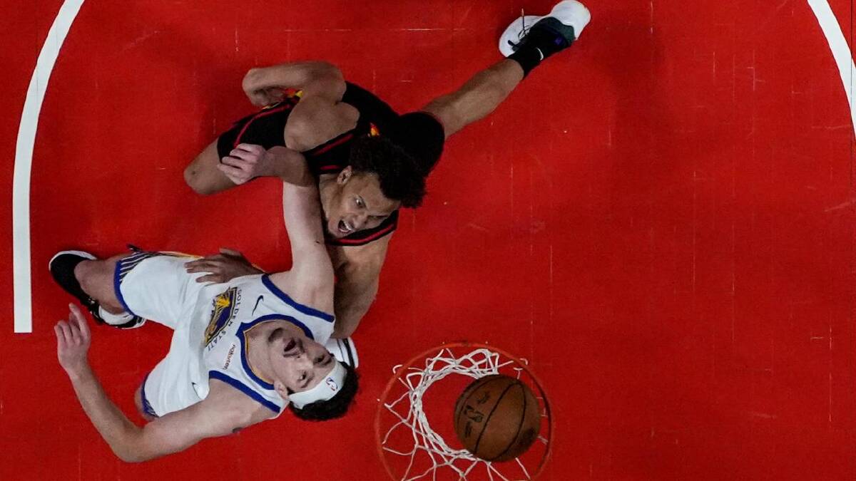 Dyson Daniels (top) scores against Golden State centre Quinten Post. (AP PHOTO)