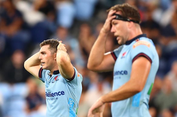 Waratahs Lawson Creighton and Angus Blyth hold their heads. How long will fickle Sydney rugby fans back the team?