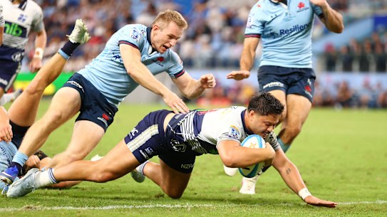 Max Jorgensen can’t stop AJ Lam going over for the Blues.