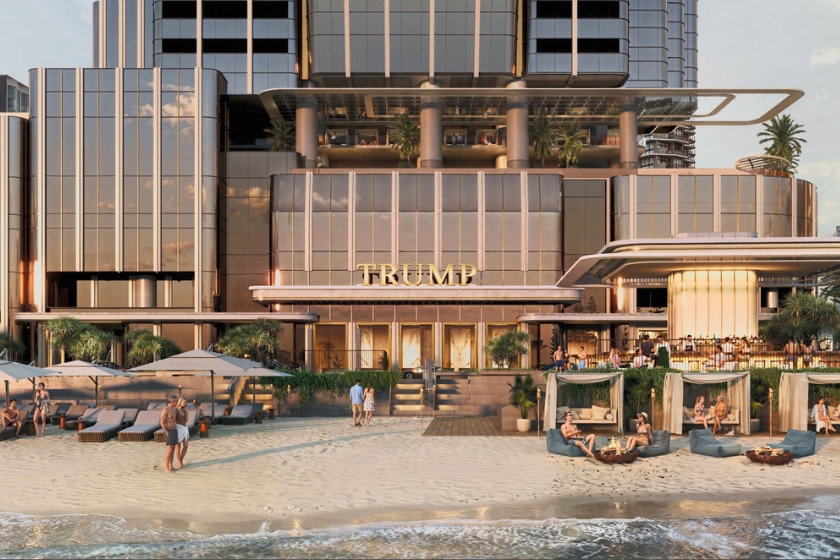 A rendered image of a hotel with the word trump on it and cabanas on a beach in front. 