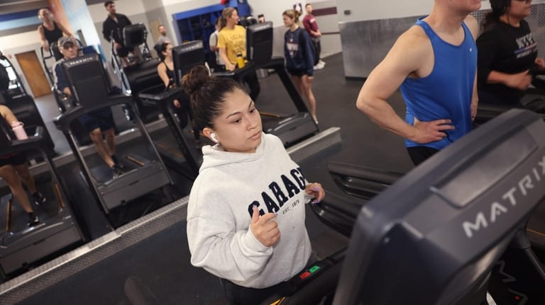 Lucero Ardiles, of Baldwin, exercises at Crunch in Bellmore after...