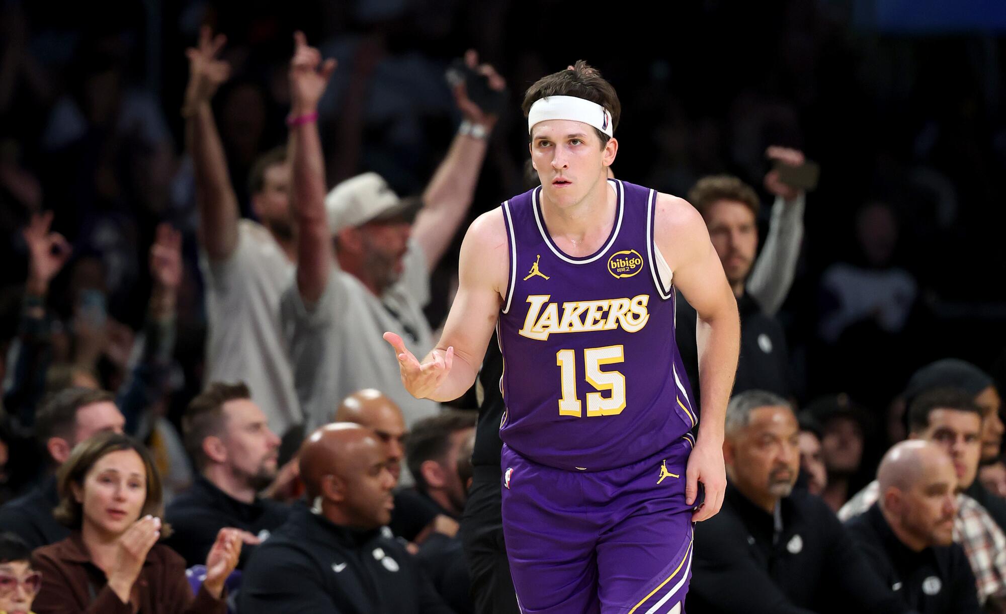 Lakers guard Austin Reaves celebrates after shooting a three-pointer against the Nets in the second half Friday.