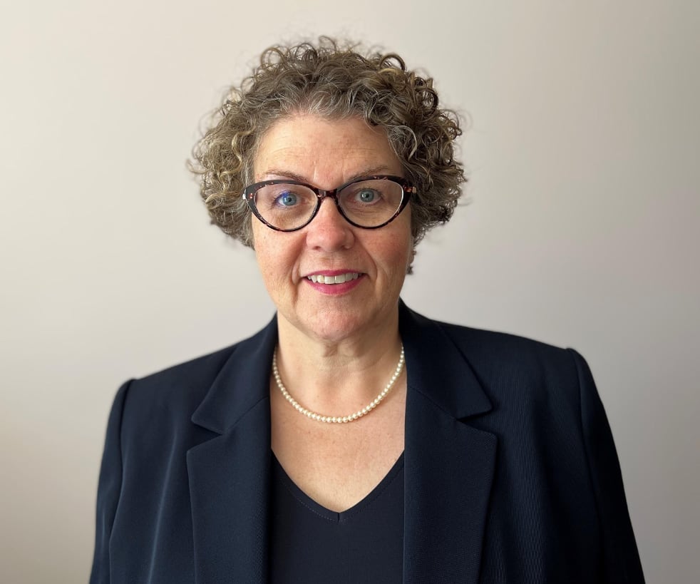 A woman poses for a photo.