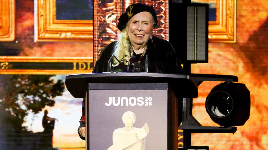 A woman stands on a stage.
