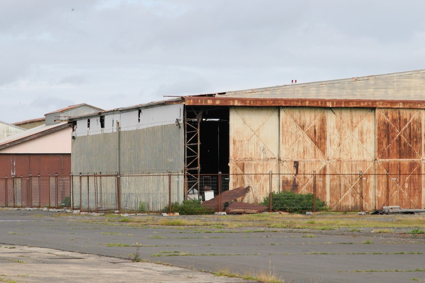 An abandoned aircraft hanger. 