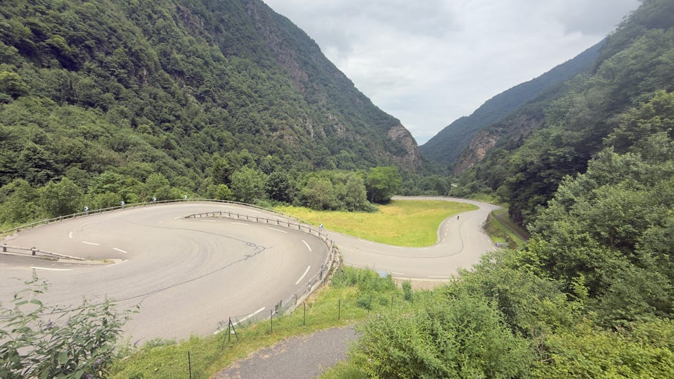 Winding road through a mountainous landscape Winding road through a mountainous landscape