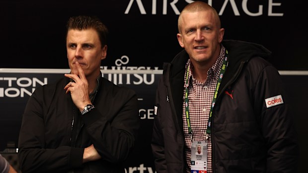 MELBOURNE, AUSTRALIA - JULY 25: Matthew Lloyd, Dustin Fletcher, 2000 premiership players during the 2025 AFL Round 20 match between the Essendon Bombers and the Western Bulldogs at Marvel Stadium on July 25, 2025 in Melbourne, Australia. (Photo by James Wiltshire/AFL Photos via Getty Images)