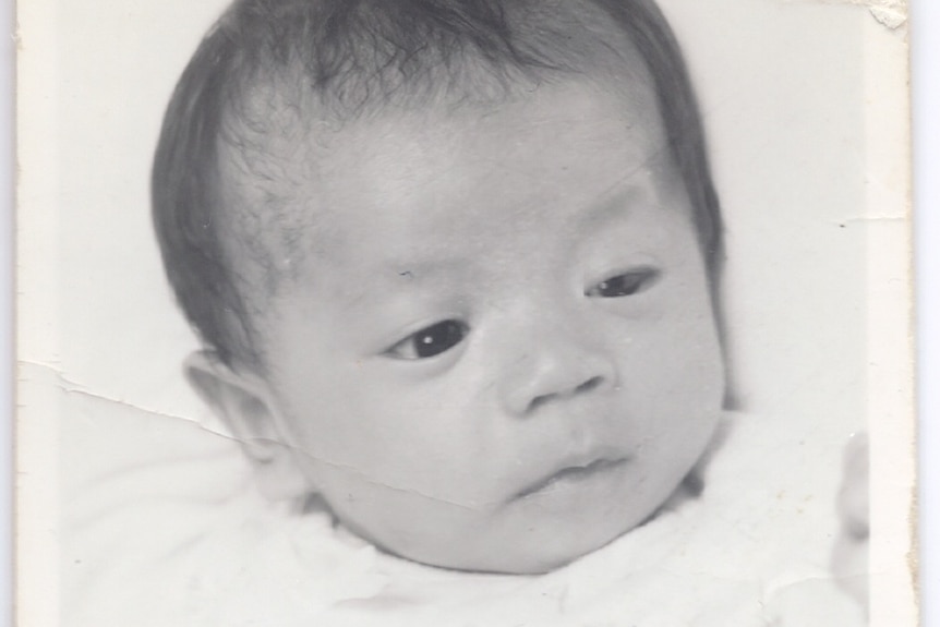 A black and white photo of a baby 