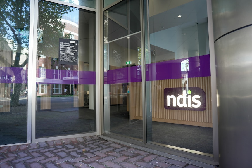 A building with NDIS signage at the front door.