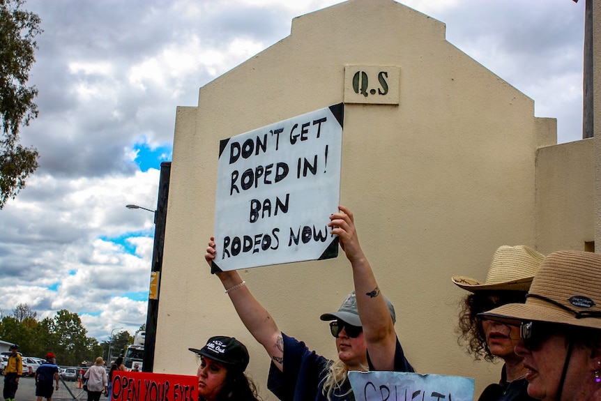 A protester holding a sign 