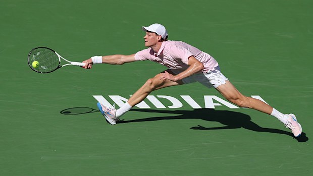 Jannik Sinner of Italy returns against Daniil Medvedev of Russia.
