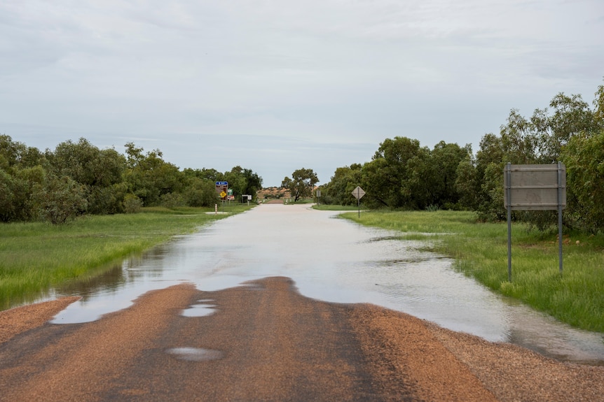 Water covering an unsealed outback road