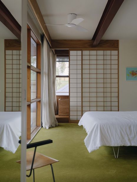 A timber bathtub is concealed by a shoji screen in the first-floor bedroom.