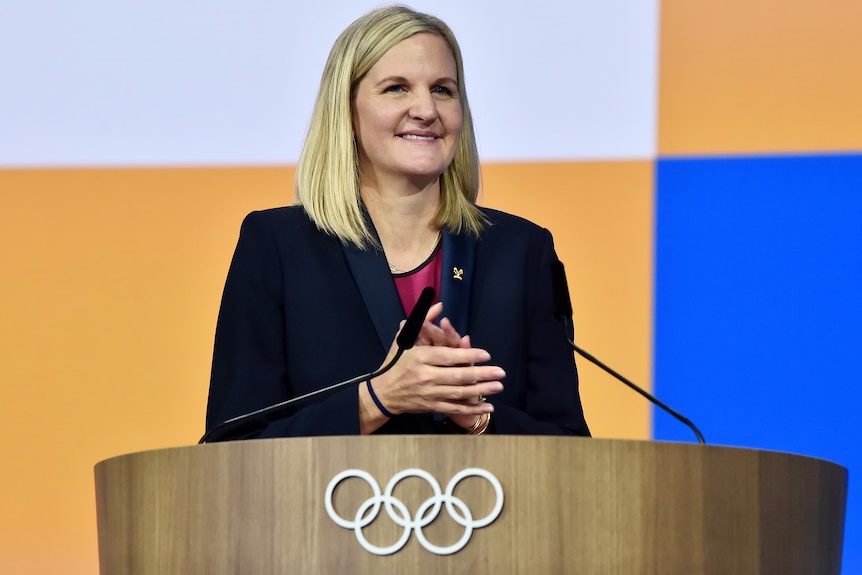 Kirsty Coventry behind an IOC podium in Greece.