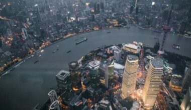 Aerial view of the buildings and river of Shanghai at night