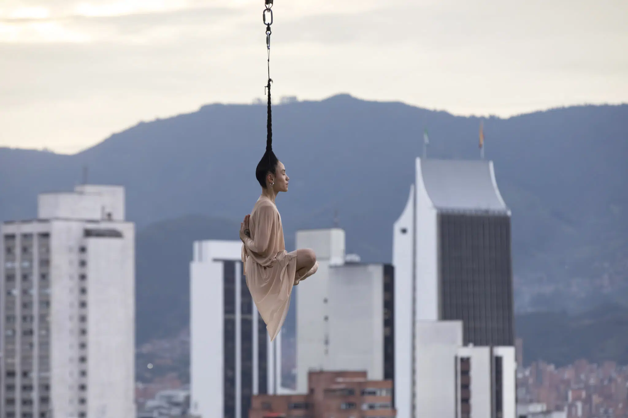 Roxana’s parents and grandparents were born outside the city of Medellín, Colombia, but were forced to move there by the guerrilla violence that was experienced in the countryside. At a very young age, Roxana learned the sporting art of hanging by her hair, which helped her survive living on the streets.